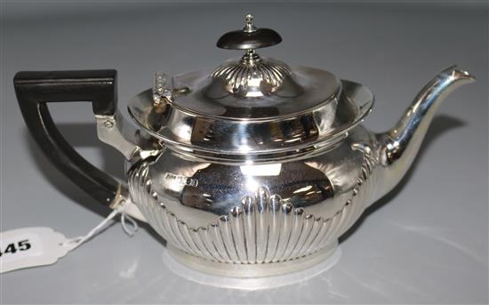 An Edwardian demi fluted silver teapot, by Mappin & Webb, gross 12.5 oz.